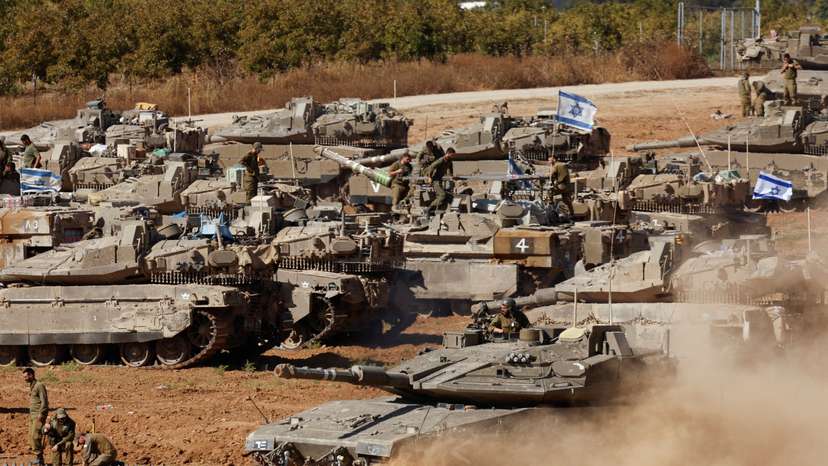 An Israeli tank maneuvers, amid the ongoing conflict between Israel and the Palestinian Islamist group Hamas, near the Israel-Gaza Border, in southern Israel