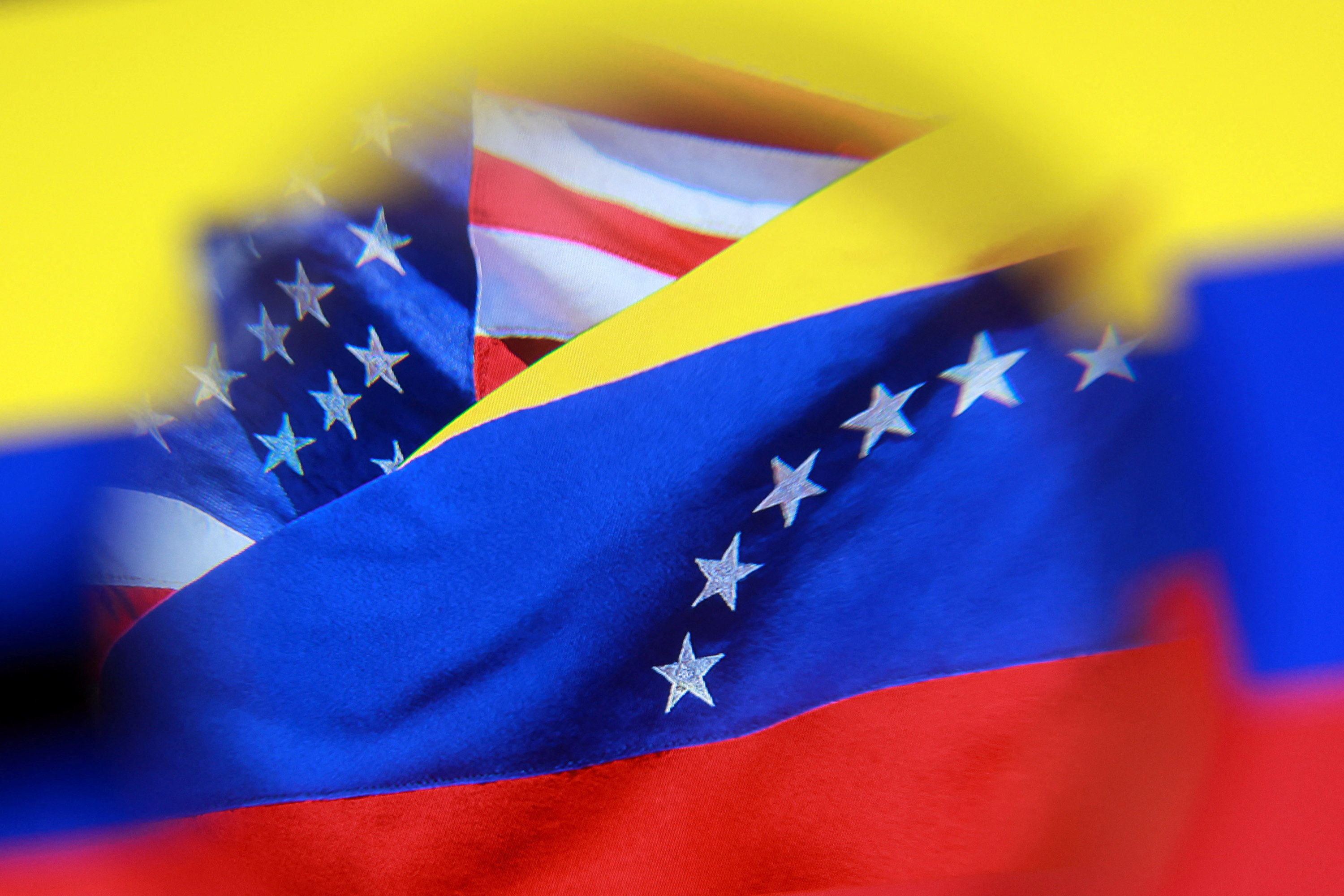 Illustration shows U.S. and Venezuelan flags