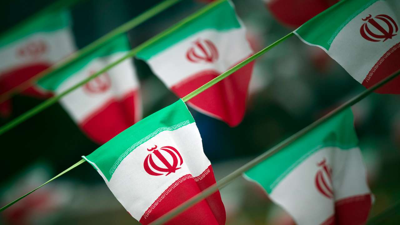 Iran's national flags are seen on a square in Tehran