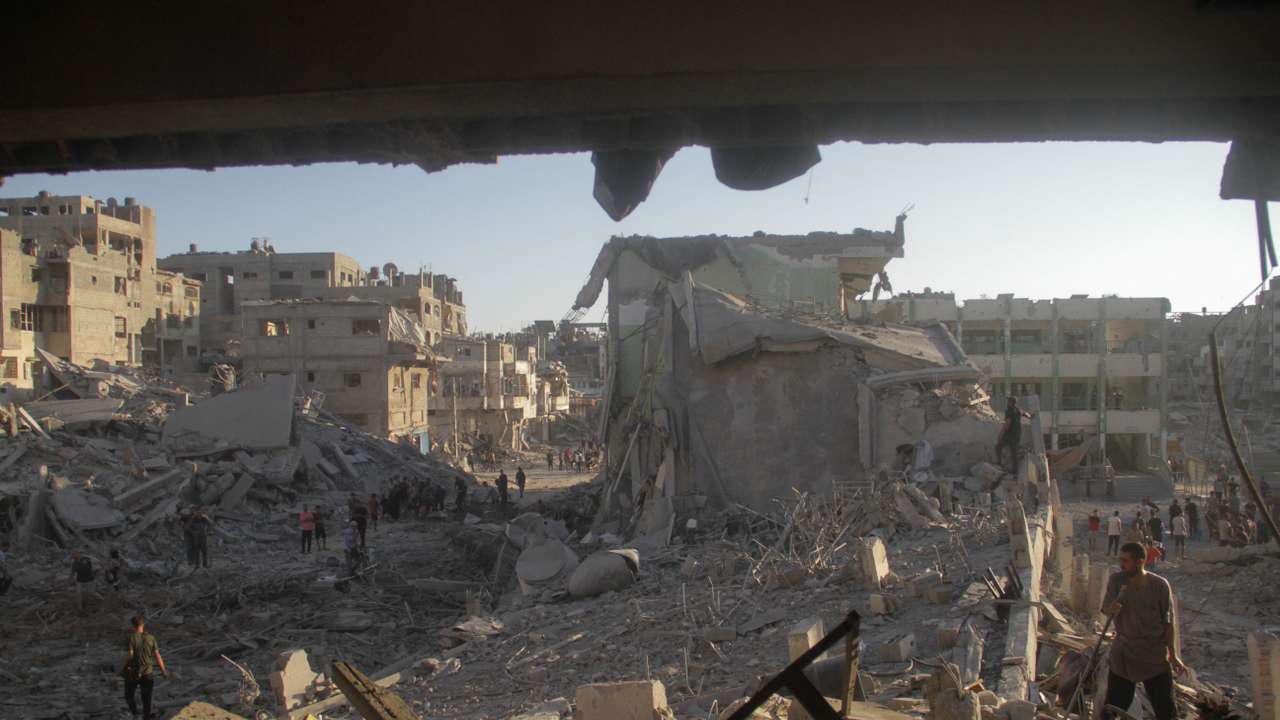 Palestinians inspect the site of Israeli strikes on a school sheltering displaced people, amid Israel-Hamas conflict, in Gaza City