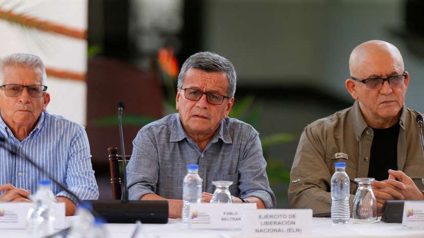 FILE PHOTO: Members of Colombia's government and Colombia's National Liberation Army (ELN) delegation address the media, in Caracas