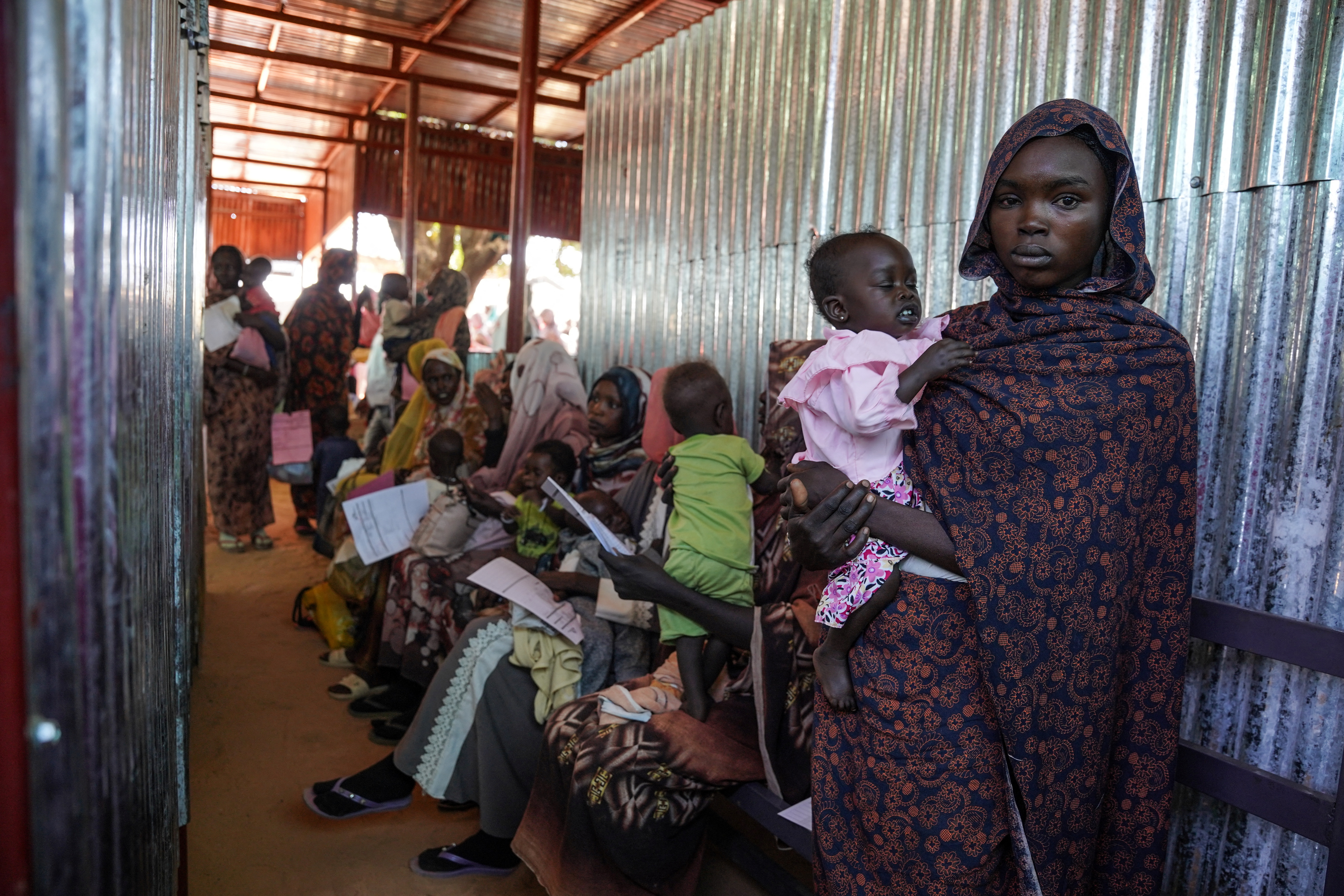Handout photograph of a woman and baby at the Zamzam displacement camp in North Darfur