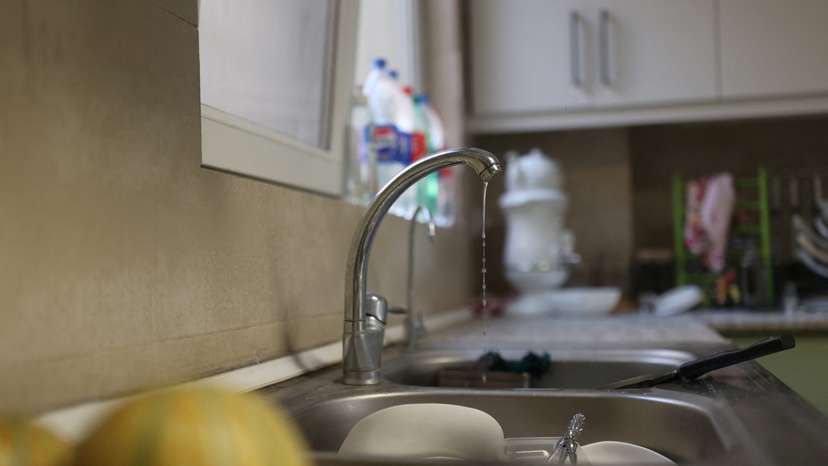 A small amount of water pours out of the faucet following a drought crisis in Tehran