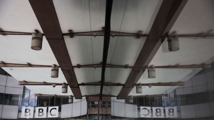 The BBC logo is displayed above the entrance to the BBC headquarters in London