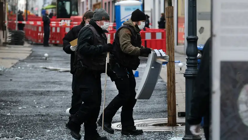 FILE PHOTO: Law enforcement officers investigate the scene following an attack on bank ATMs in Ratingen