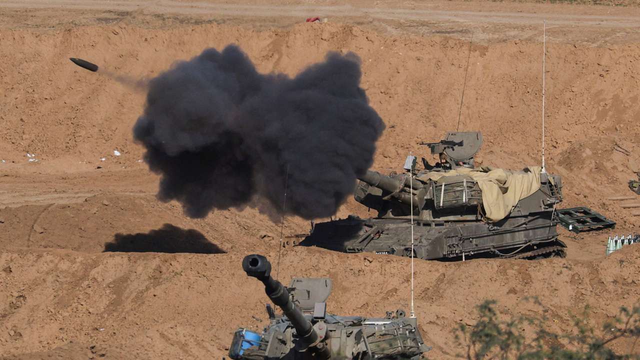 An Israeli self-propelled artillery unit fires as seen from southern Israel