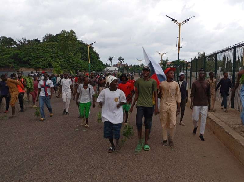Demonstrators hold Russian flag as Nigerians continue to protest against economic hardship, in Kaduna state
