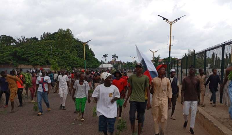 Demonstrators hold Russian flag as Nigerians continue to protest against economic hardship, in Kaduna state