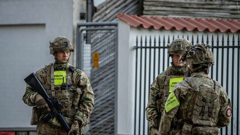 Police officers investigate two blasts near Israel's embassy in Copenhagen