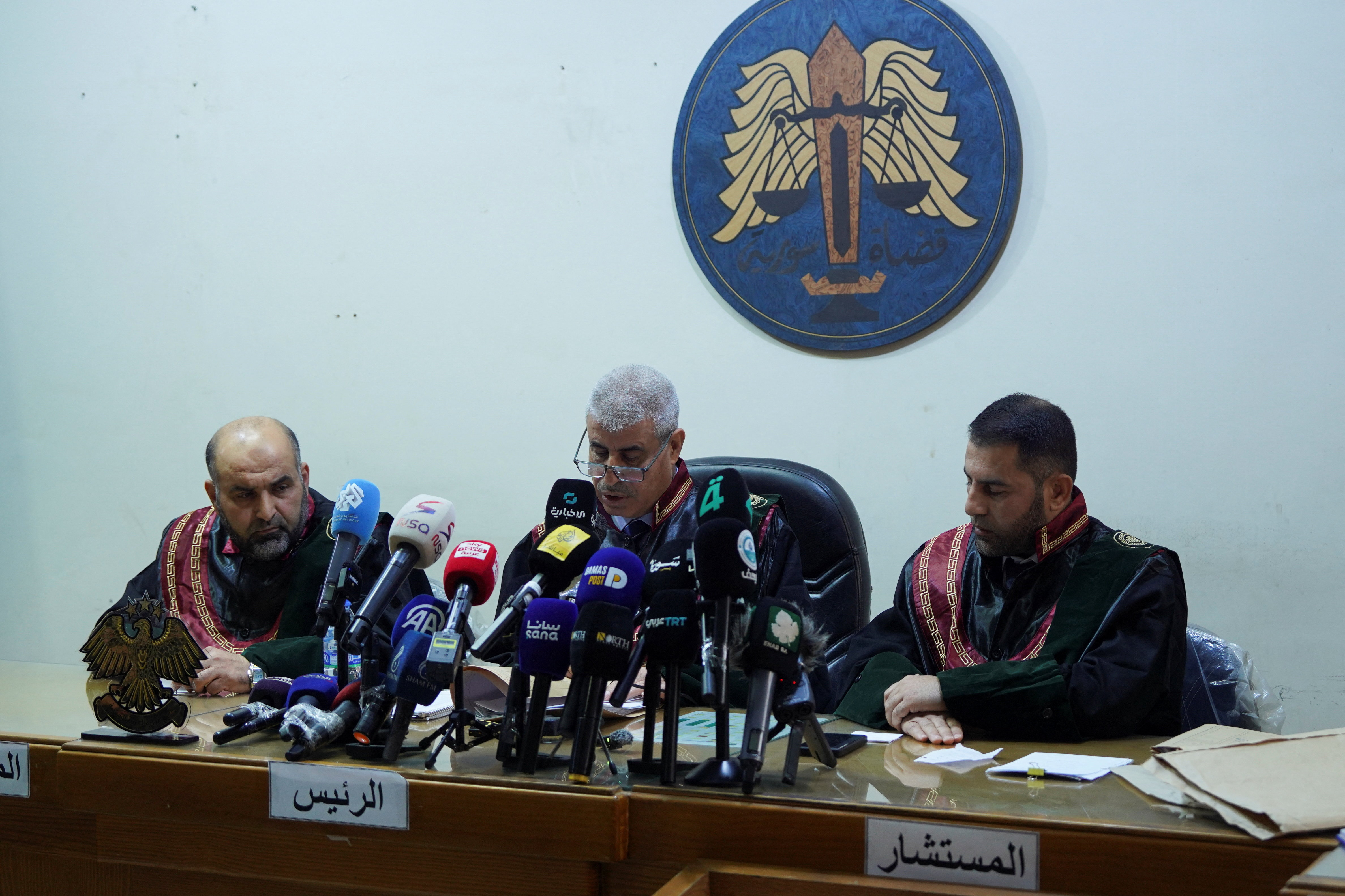 A judge speaks during the trial at the Palace of Justice in Aleppo