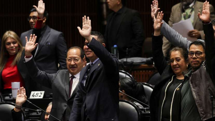 Congress members oppose a reform during a session, in Mexico City