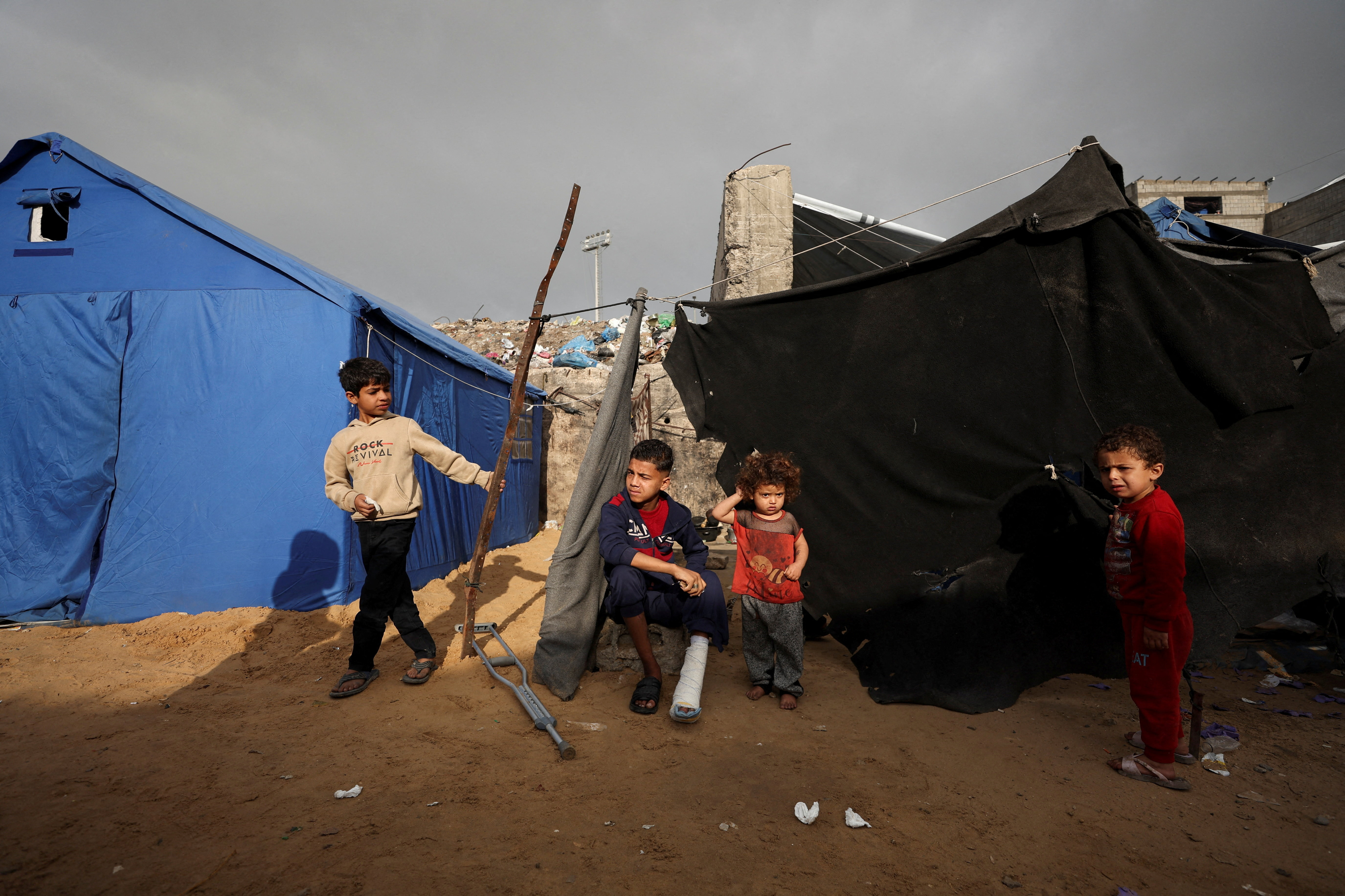 Displaced Palestinians shelter at a tent camp in Gaza City