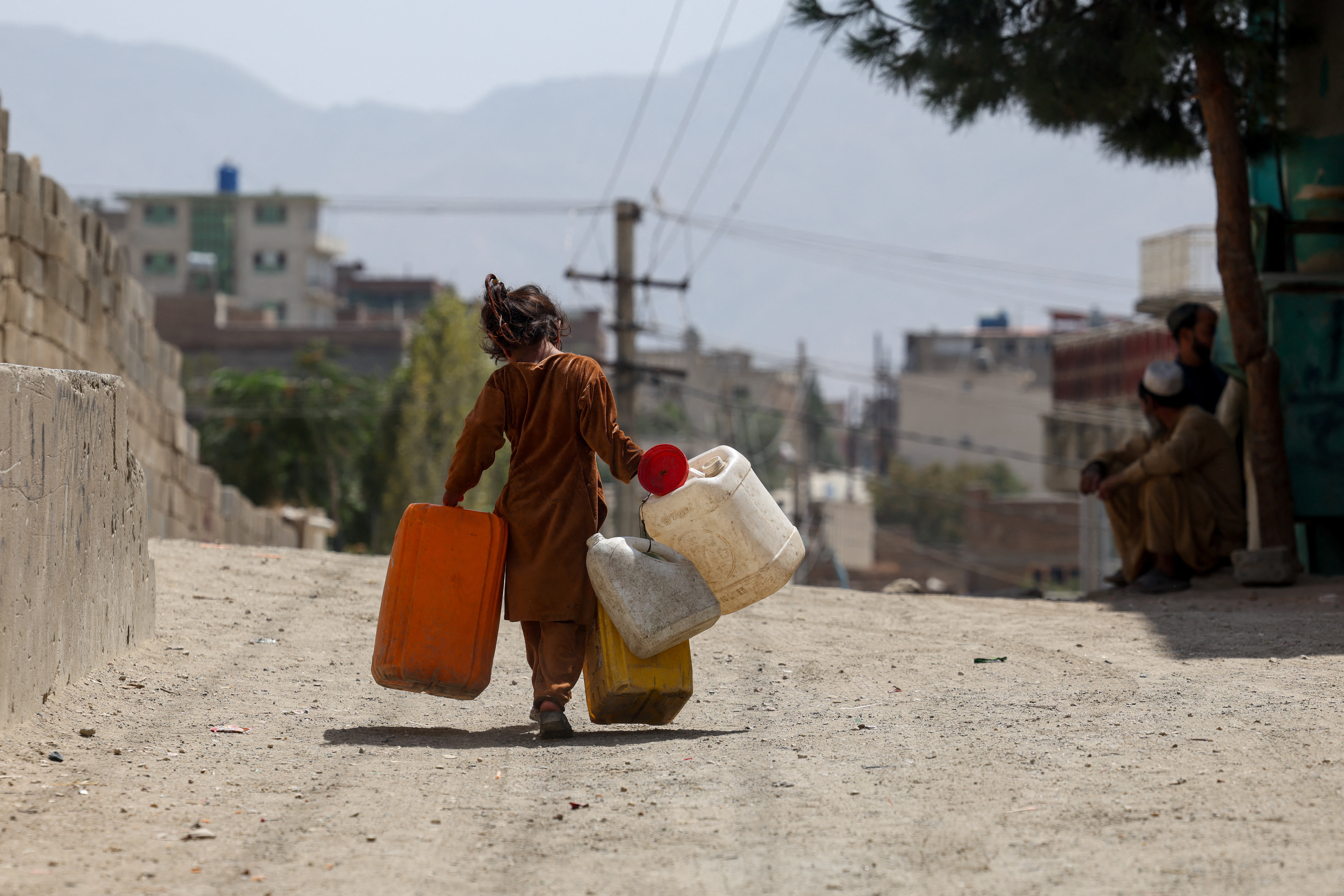 Water crisis forces families into long queues and threatens children's education in Kabul