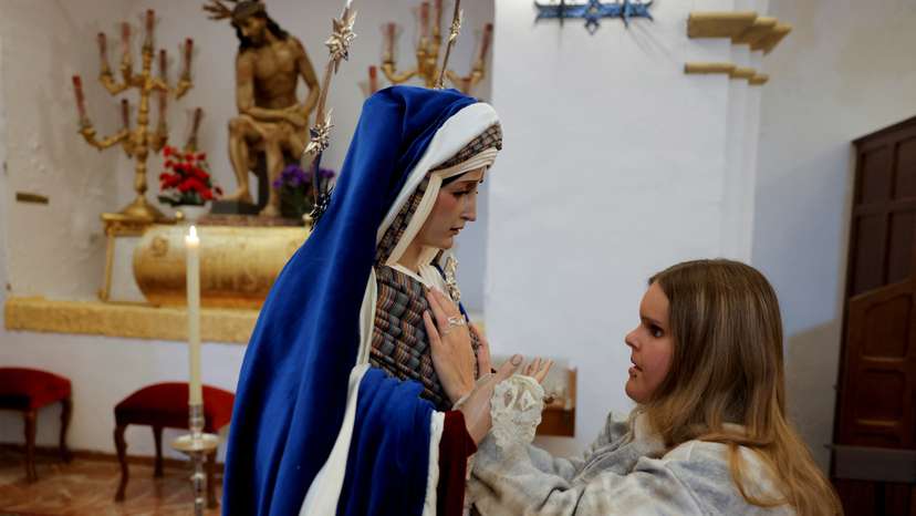 Visually impaired faithful explore Easter statues by fingertip in Ronda