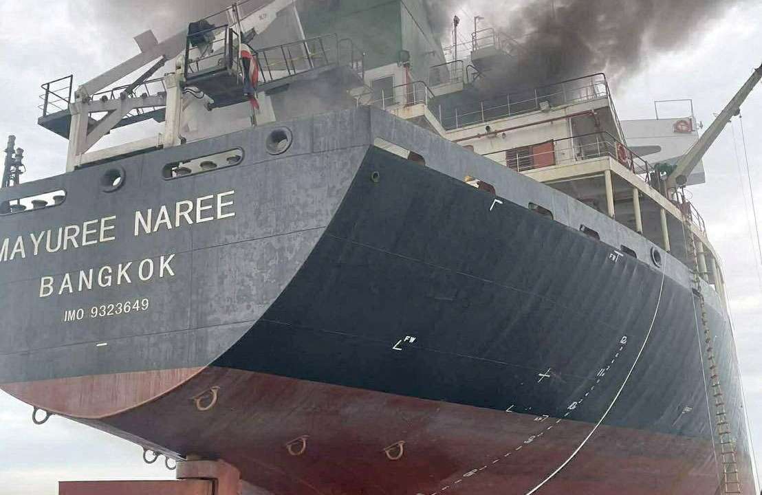 The Thailand-flagged cargo ship Mayuree Naree engulfed in black smoke in the Strait of Hormuz