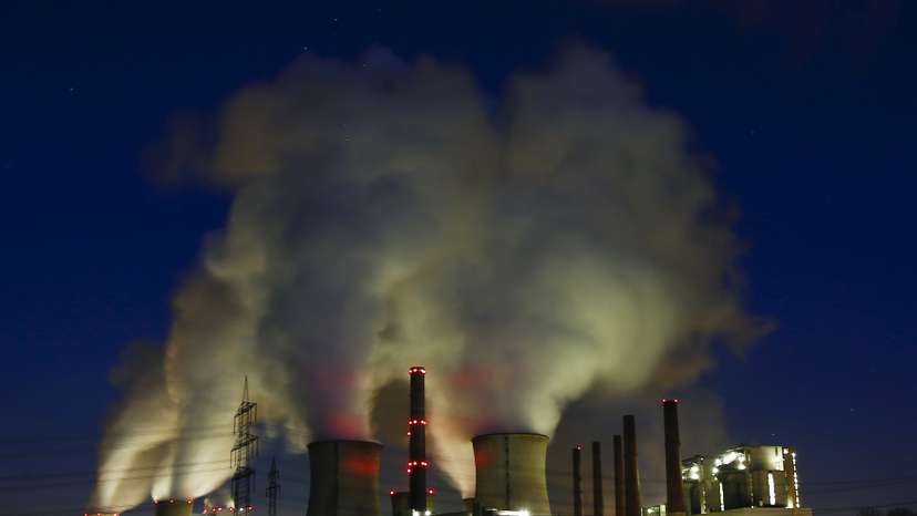 Steam rises from the chimneys of the coal power plant of RWE Power in Neurath