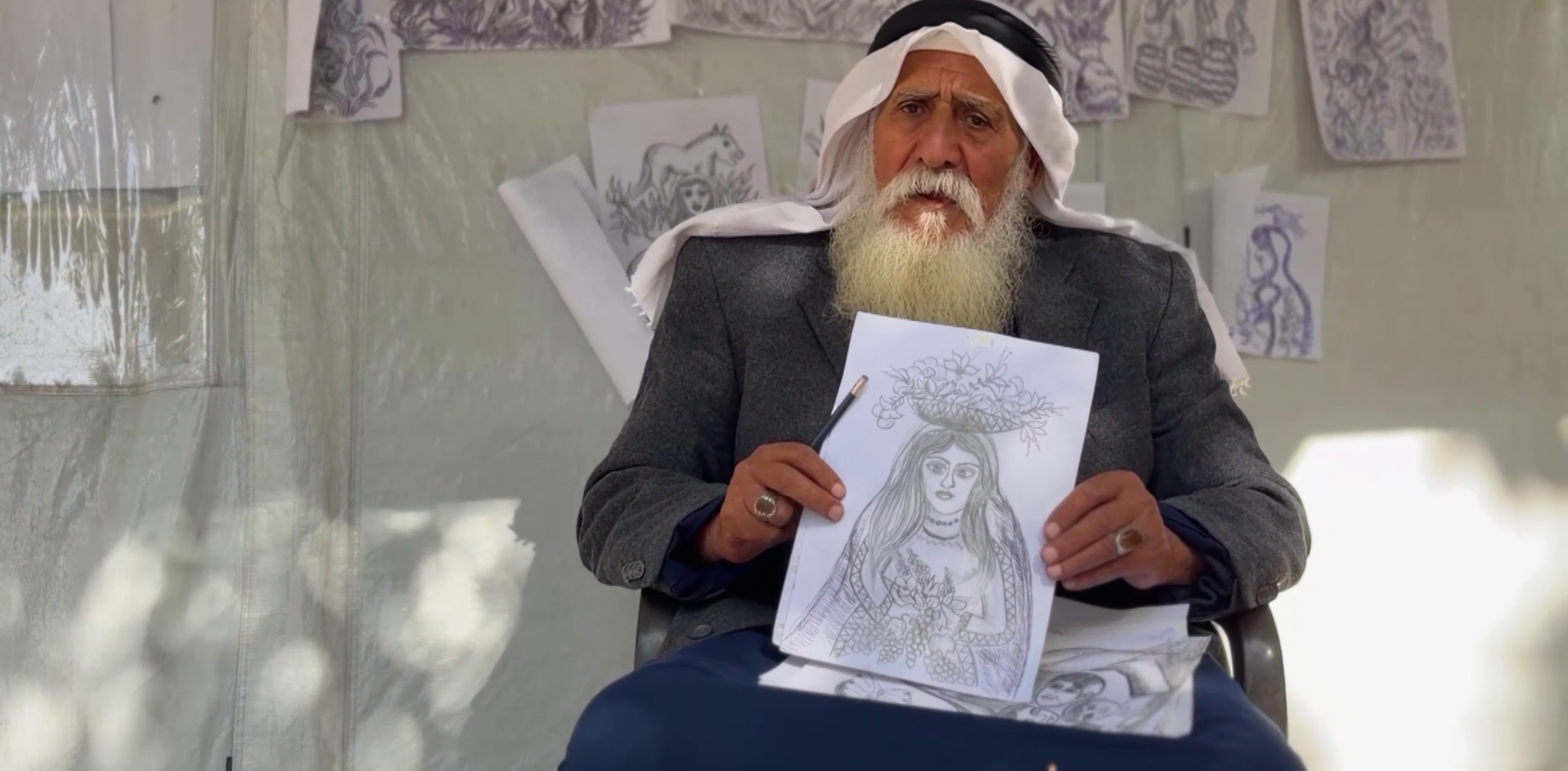 Elderly artist in Gaza camp uses charcoal drawing