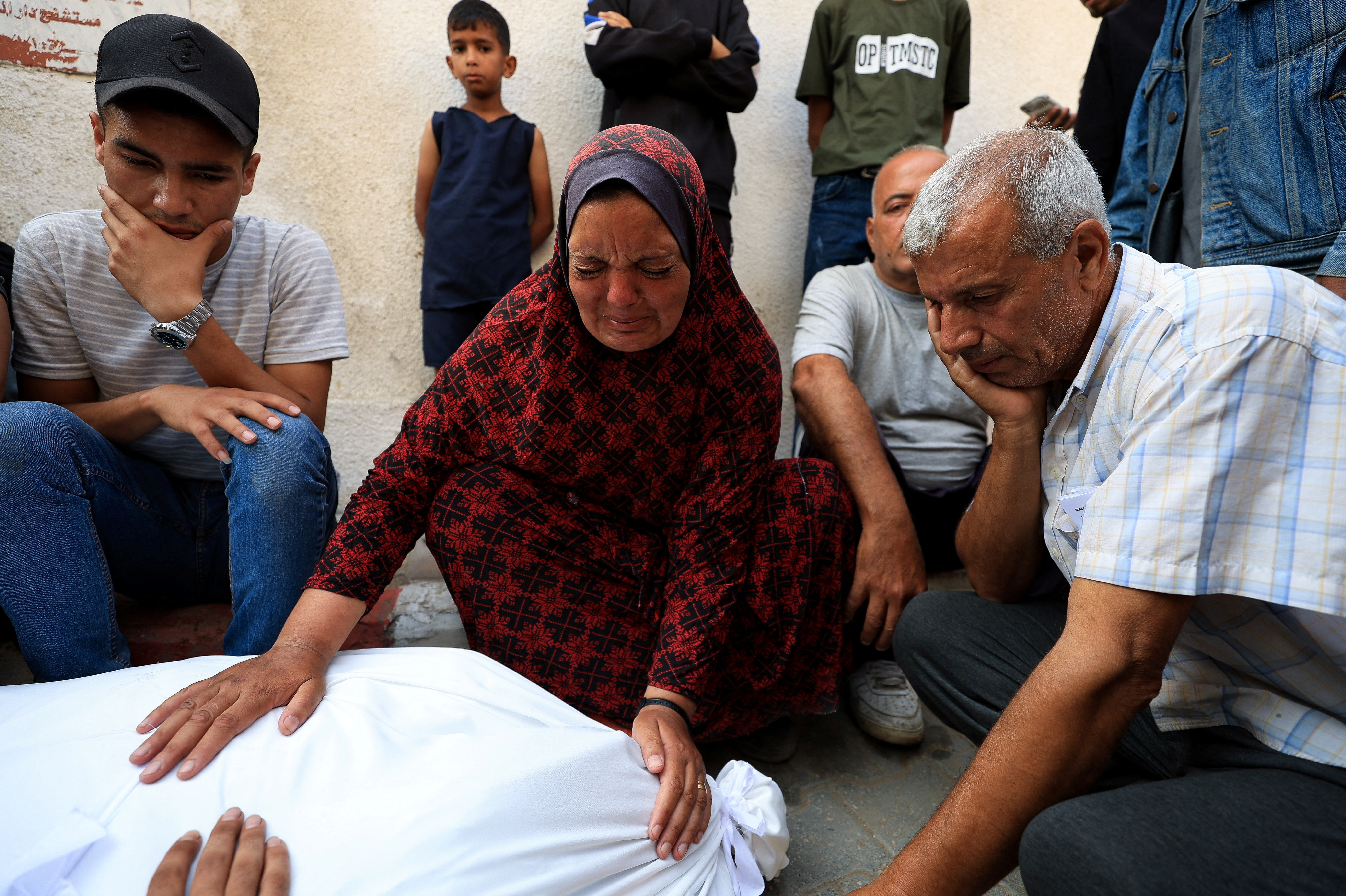 Mourners react during the funeral of Palestinians killed by Israeli fire, according to the Gaza health ministry, in Gaza City