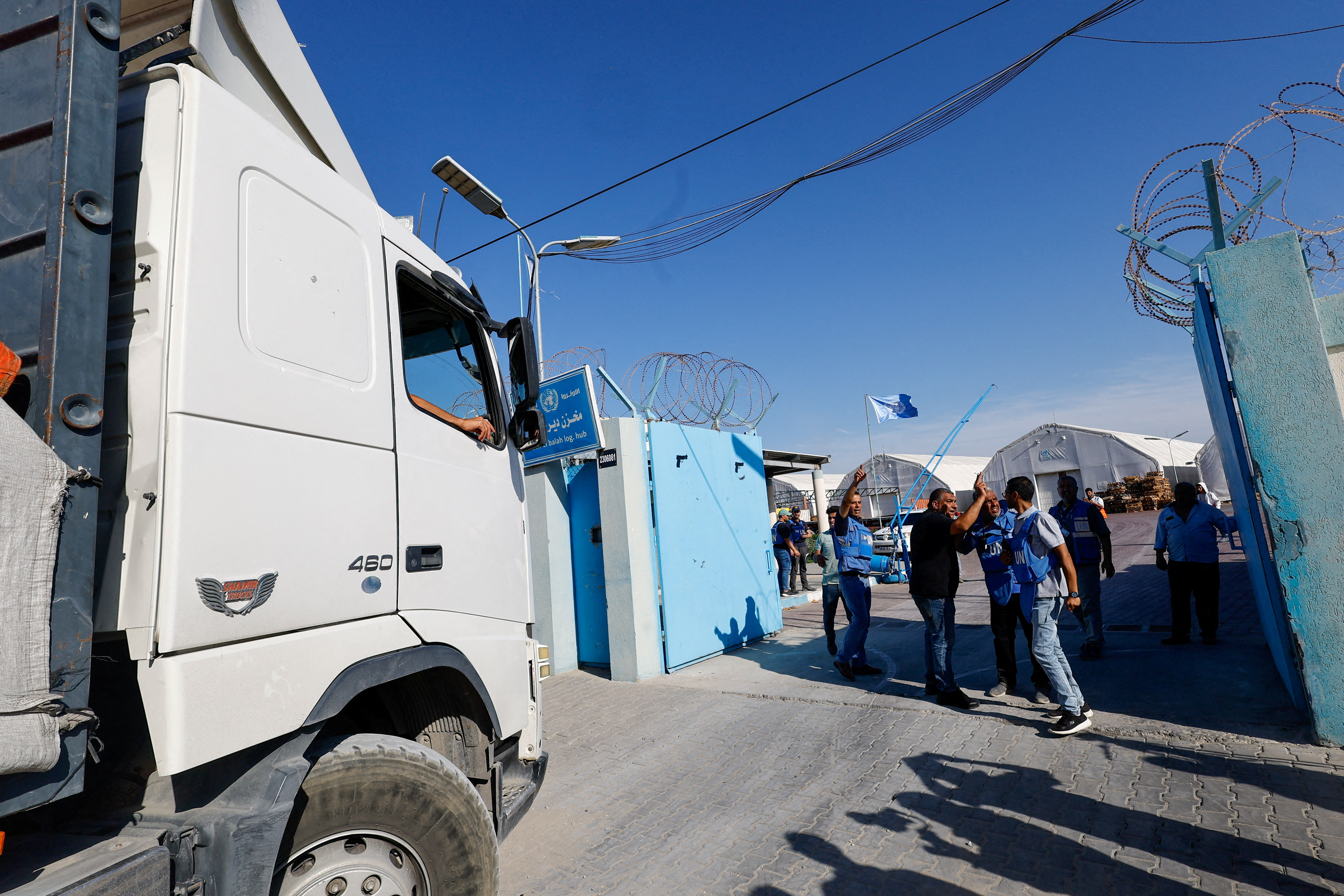 FILE PHOTO: Aid trucks arrive at a UN storage facility in the central Gaza Strip