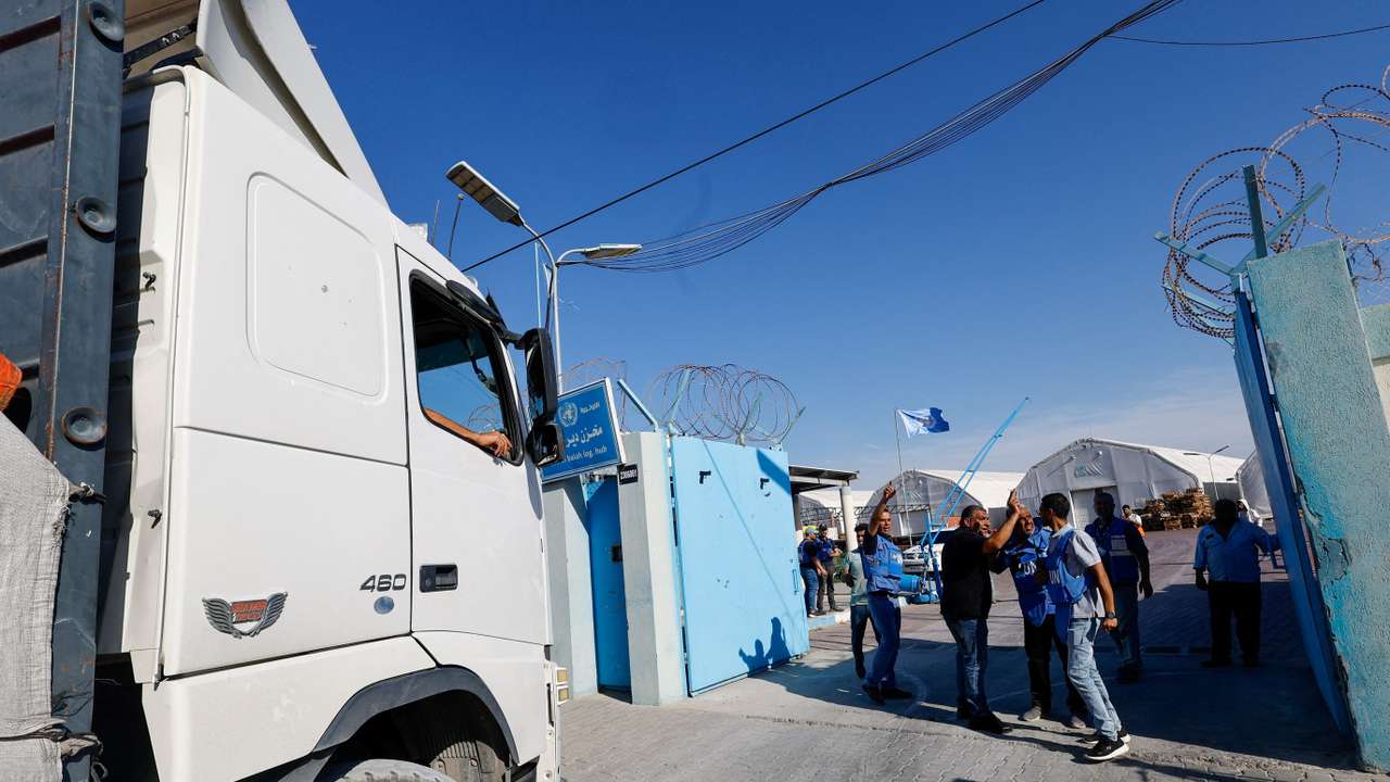 FILE PHOTO: Aid trucks arrive at a UN storage facility in the central Gaza Strip