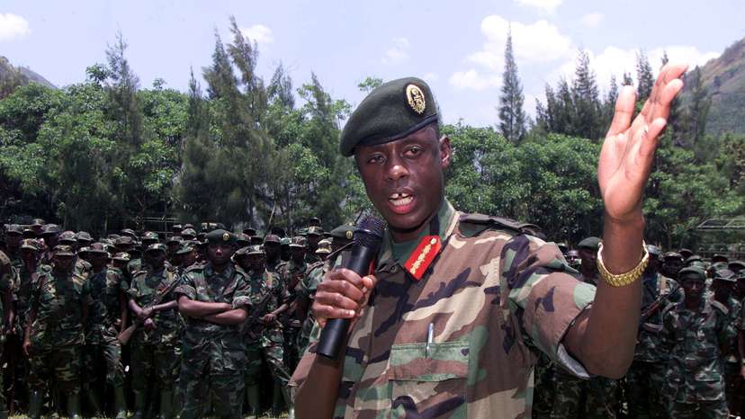 FILE PHOTO: Rwandan army chief James Kabarebe addresses soldiers pulling out of eastern Congo September 27, 2002..