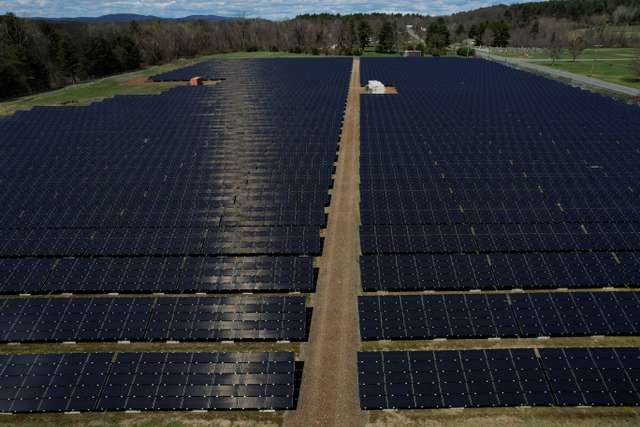 FILE PHOTO: Solar panels are arrayed on Earth Day in Northfield