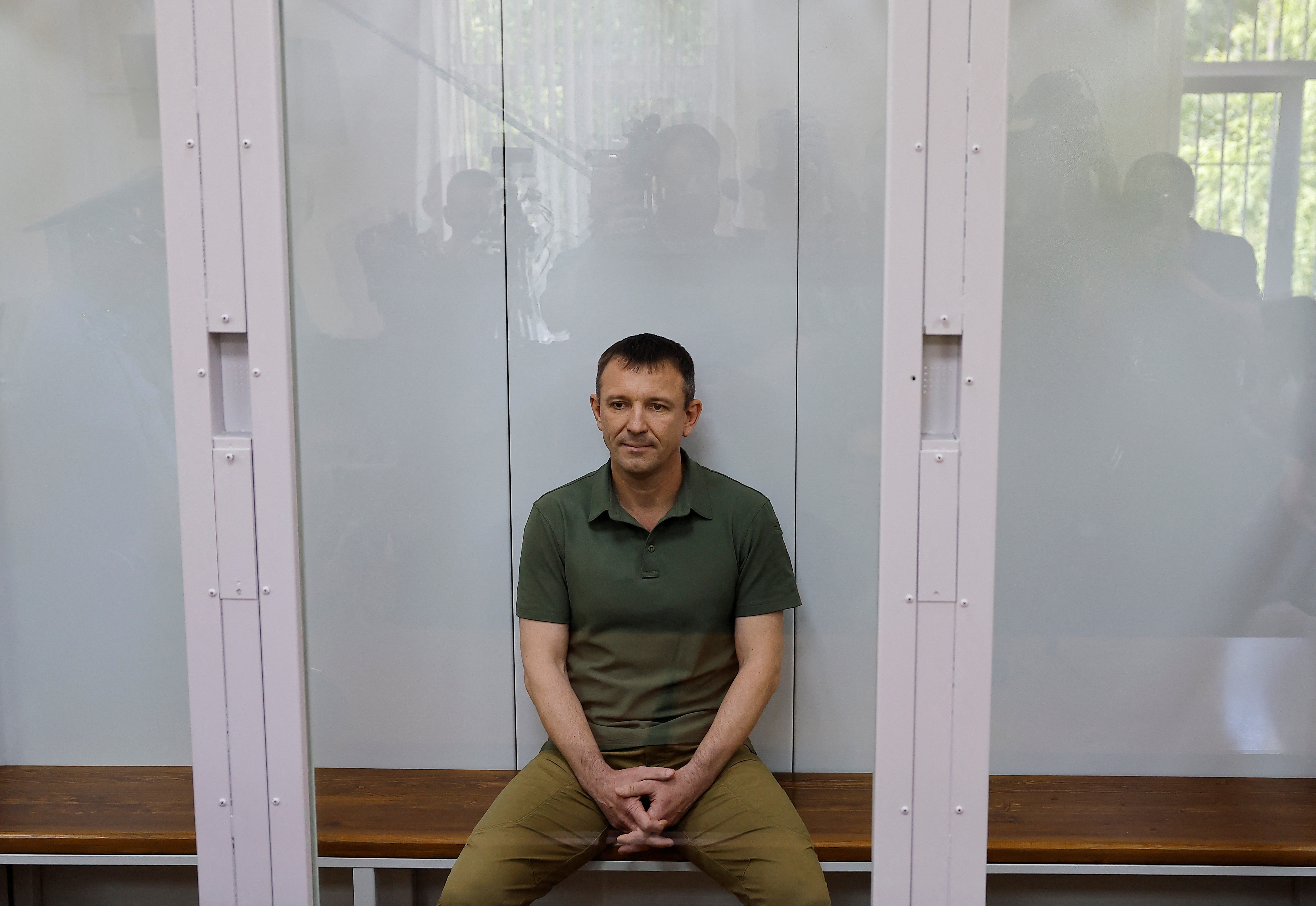 Major General Ivan Popov, arrested on suspicion of fraud, attends a hearing at the military court in Moscow
