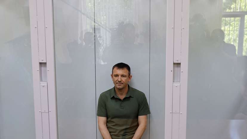 Major General Ivan Popov, arrested on suspicion of fraud, attends a hearing at the military court in Moscow