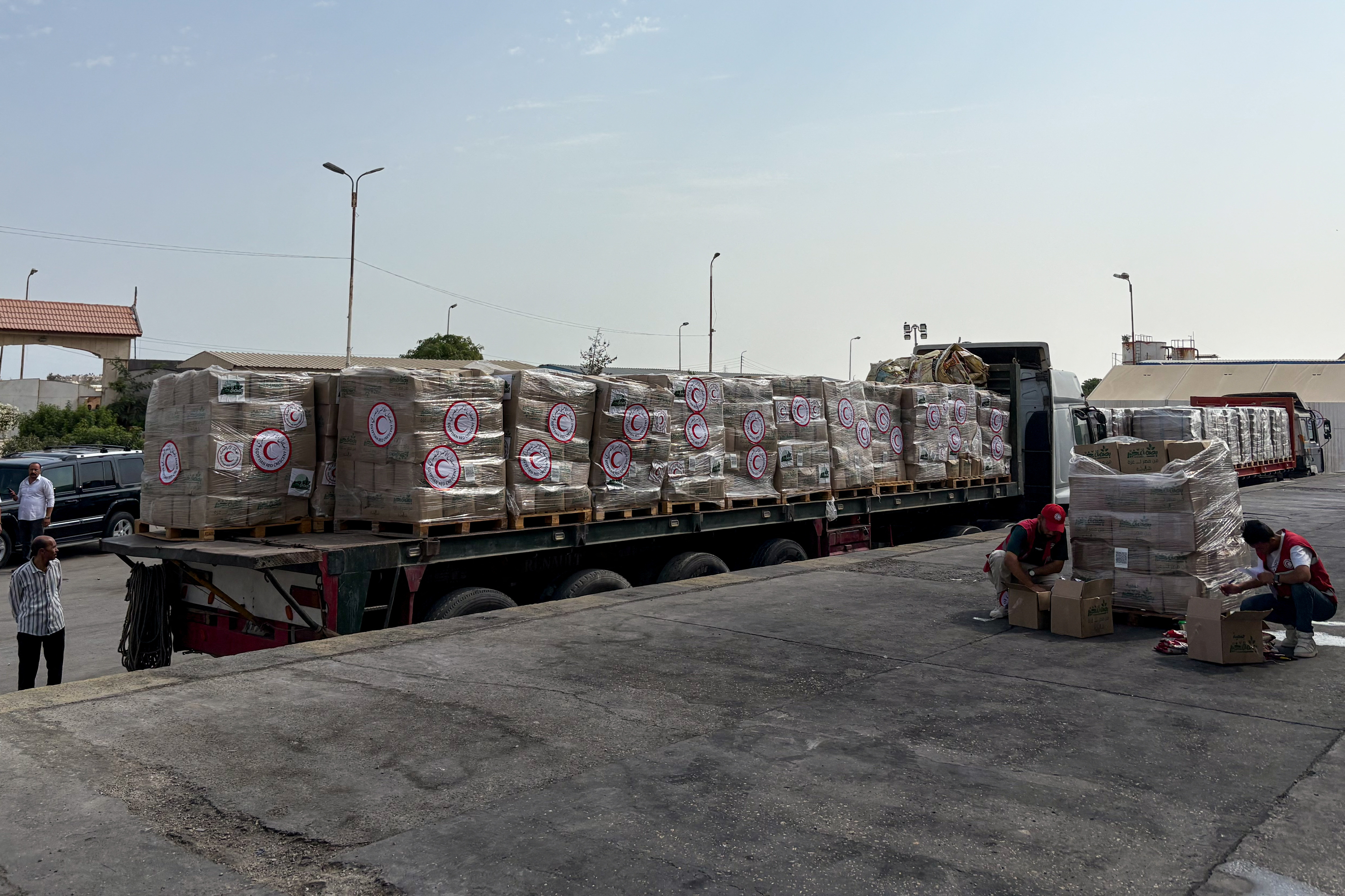 Humanitarian aid waits to be delivered to Gaza, outside Arish