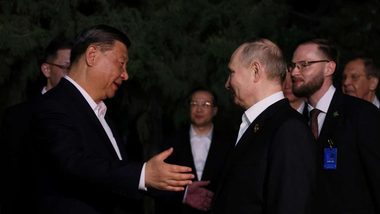 Russian President Vladimir Putin and Chinese President Xi Jinping bid farewell at the end of talks in Beijing