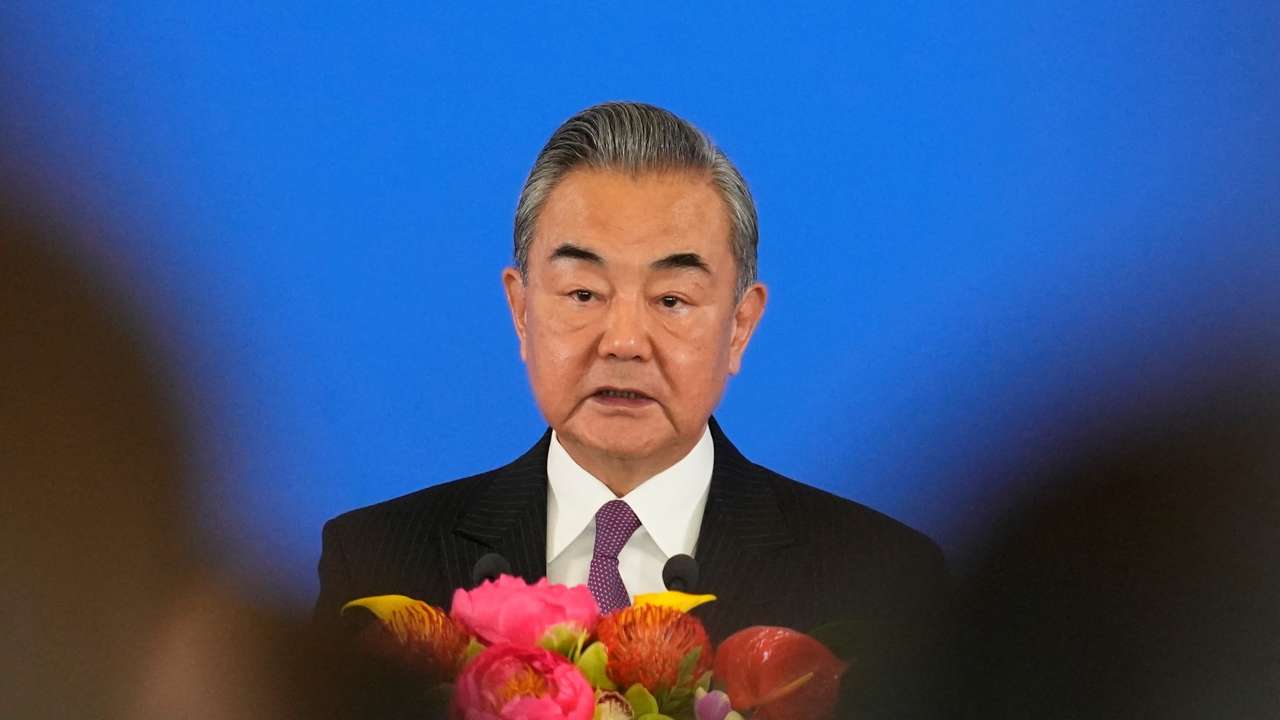 Chinese Foreign Minister Wang Yi speaks during the opening ceremony of the diplomatic symposium at the Diaoyutai State Guesthouse in Beijing
