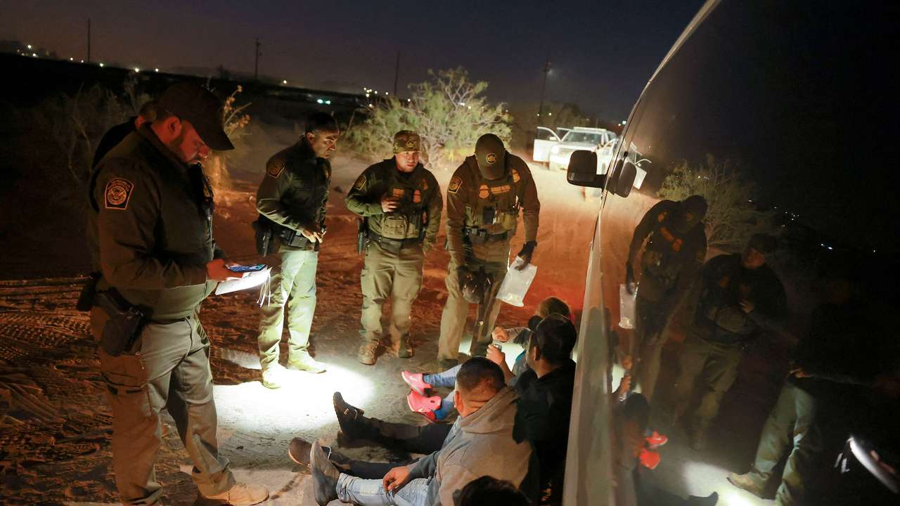 FILE PHOTO: Migrants are detained by U.S. Border Patrol agents in New Mexico