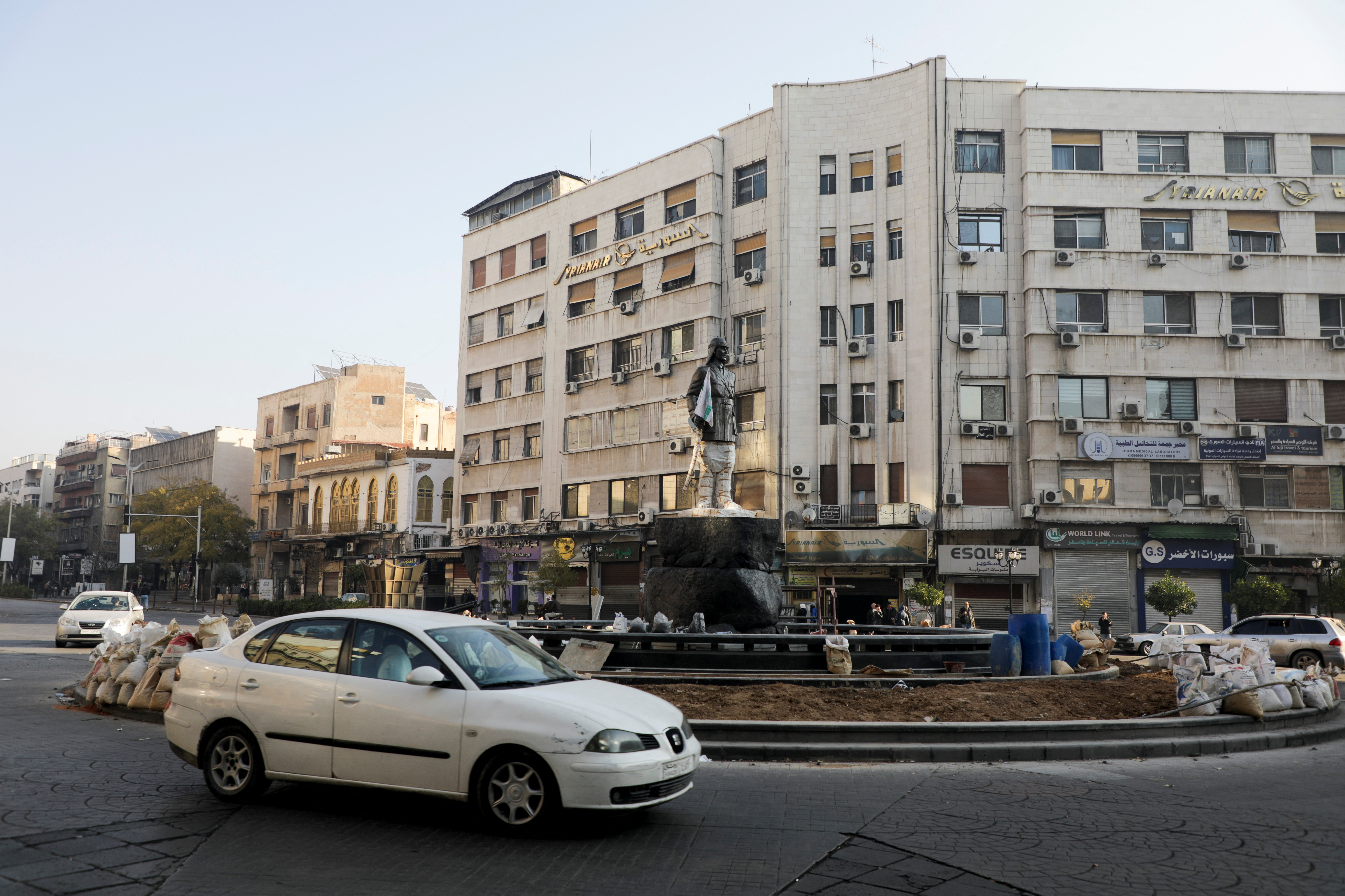 A car drives on the street, in Damascus