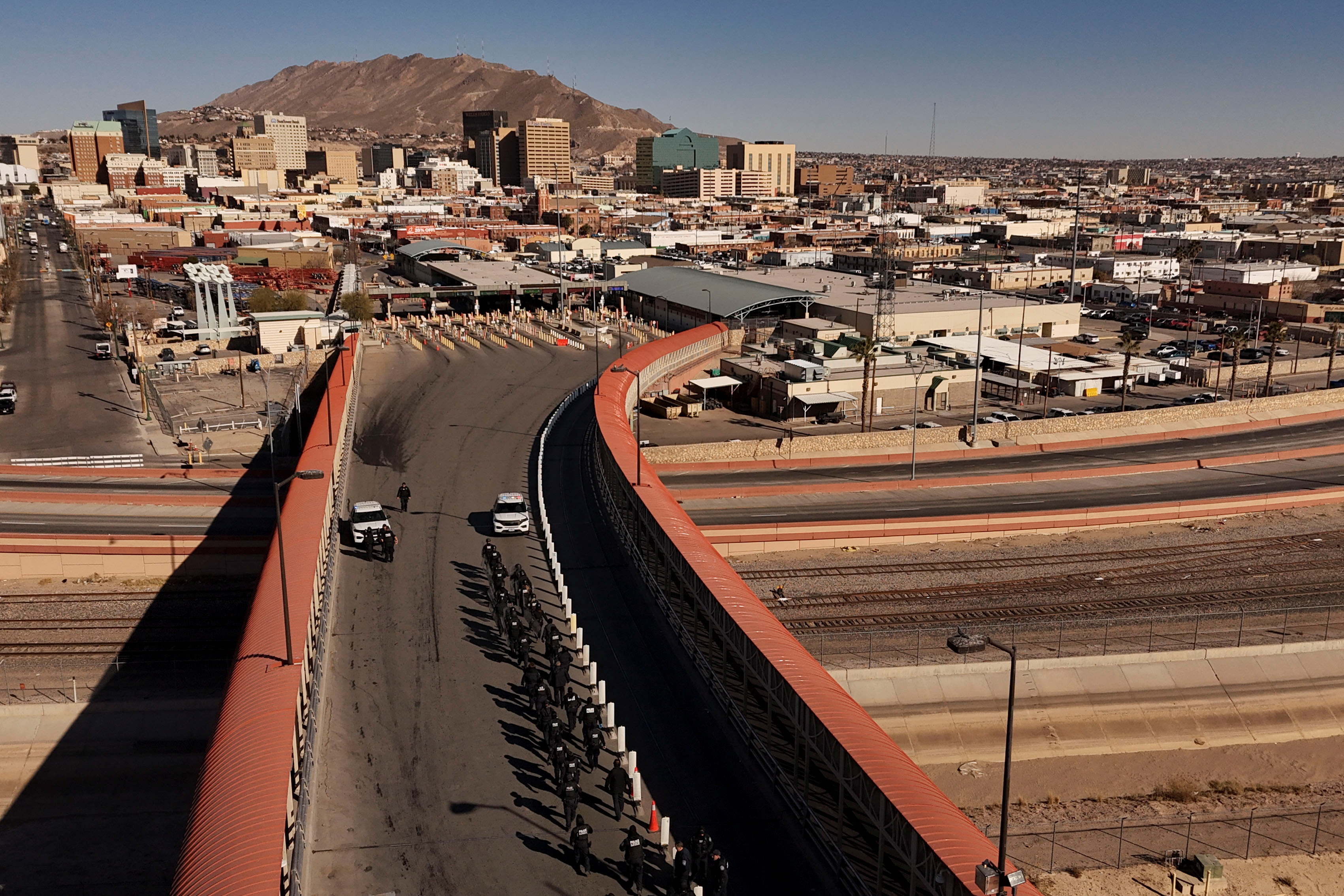 Members of U.S. Customs and Border Protection (CBP) perform a drill at the Paso del Norte International border bridge, as seen from Ciudad Juarez