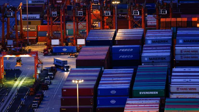 Truck carrying containers moves at Yantian port in Shenzhen, Guangdong
