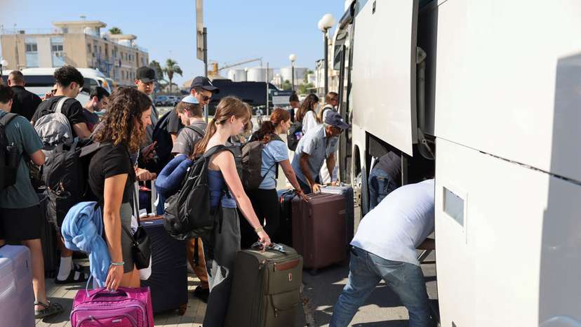 Passengers from the Crown Iris a cruise ship board buses, at the port of Larnaca