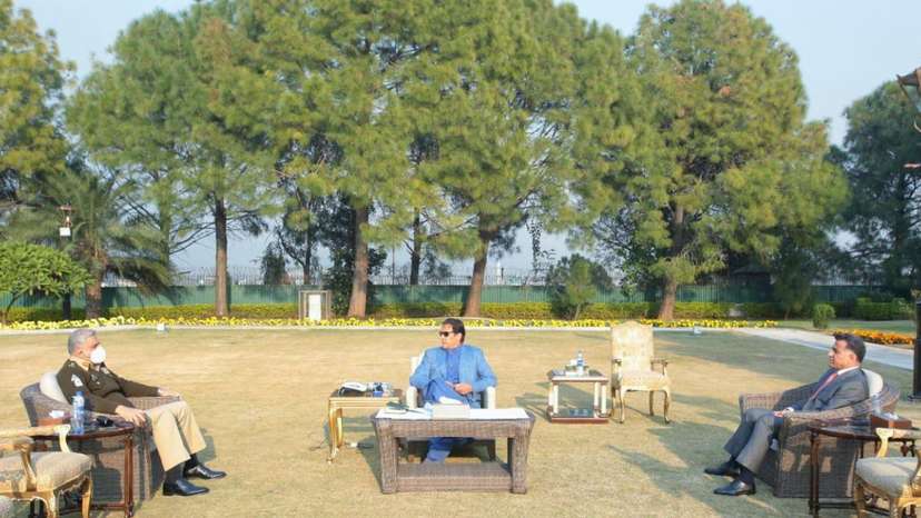 FILE PHOTO: Chief of Army Staff General Qamar Javed Bajwa and D.G ISI Lt. General Faiz Hamid call on Prime minister Imran Khan in Islamabad