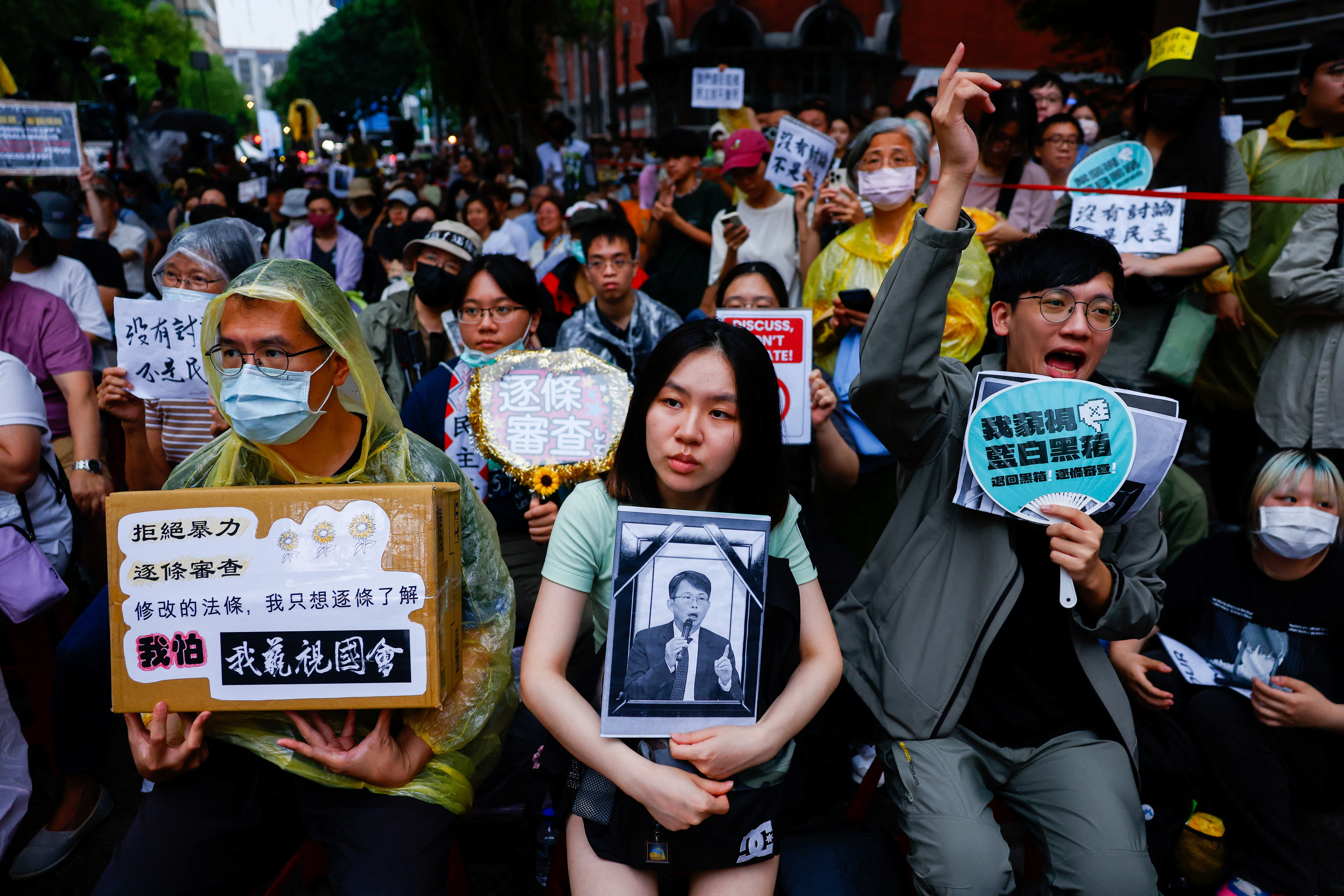 People gather outside while Taiwanese parliament is in session, in Taipei