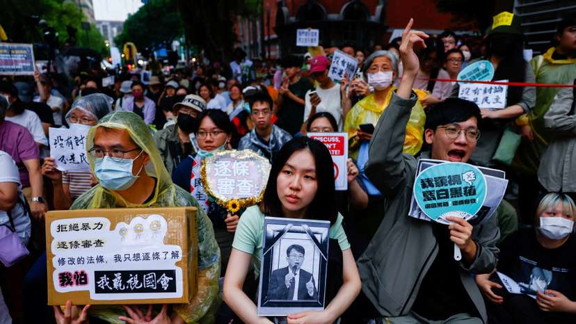 People gather outside while Taiwanese parliament is in session, in Taipei