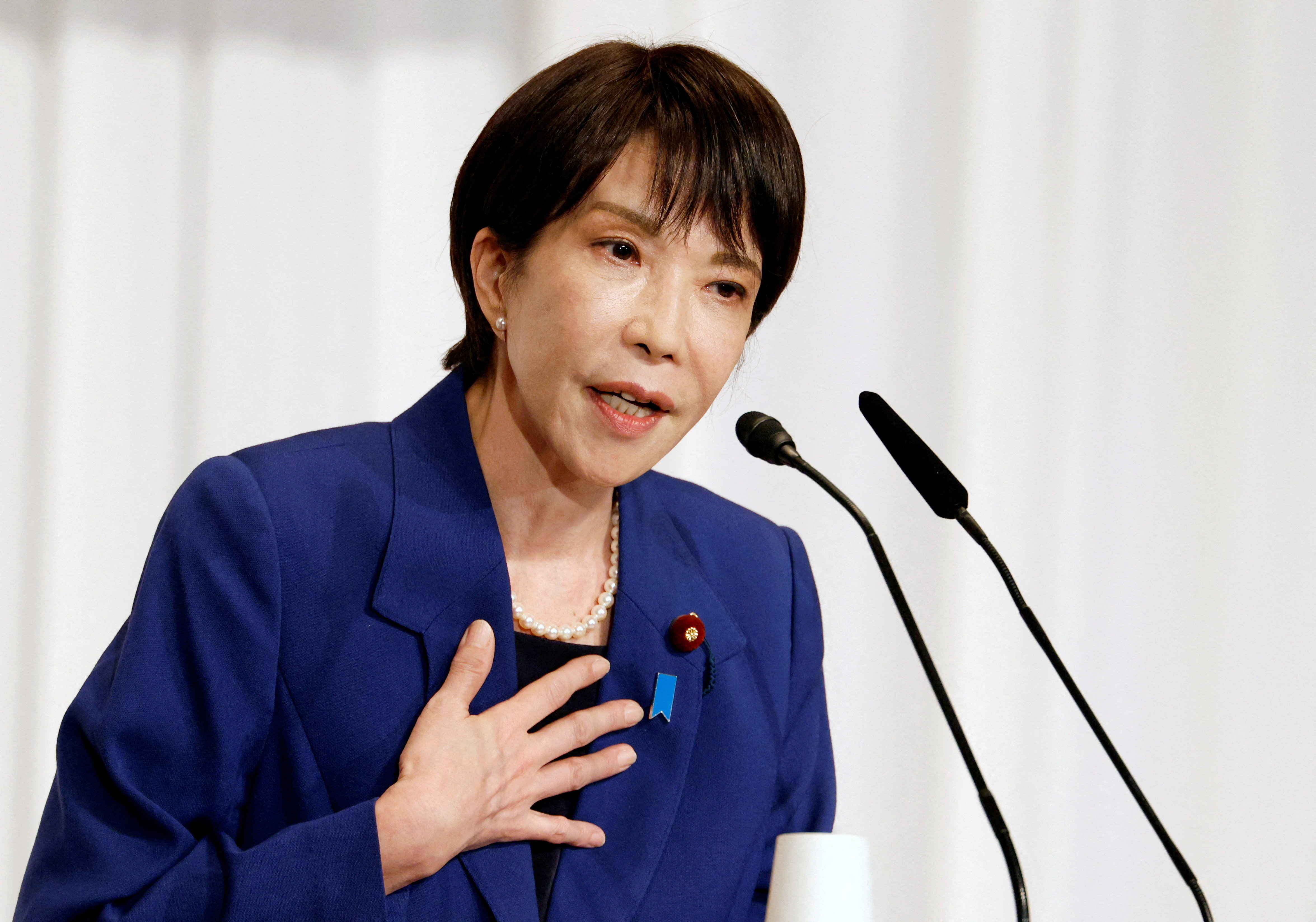 Japan's former internal affairs minister Sanae Takaichi delivers a speech