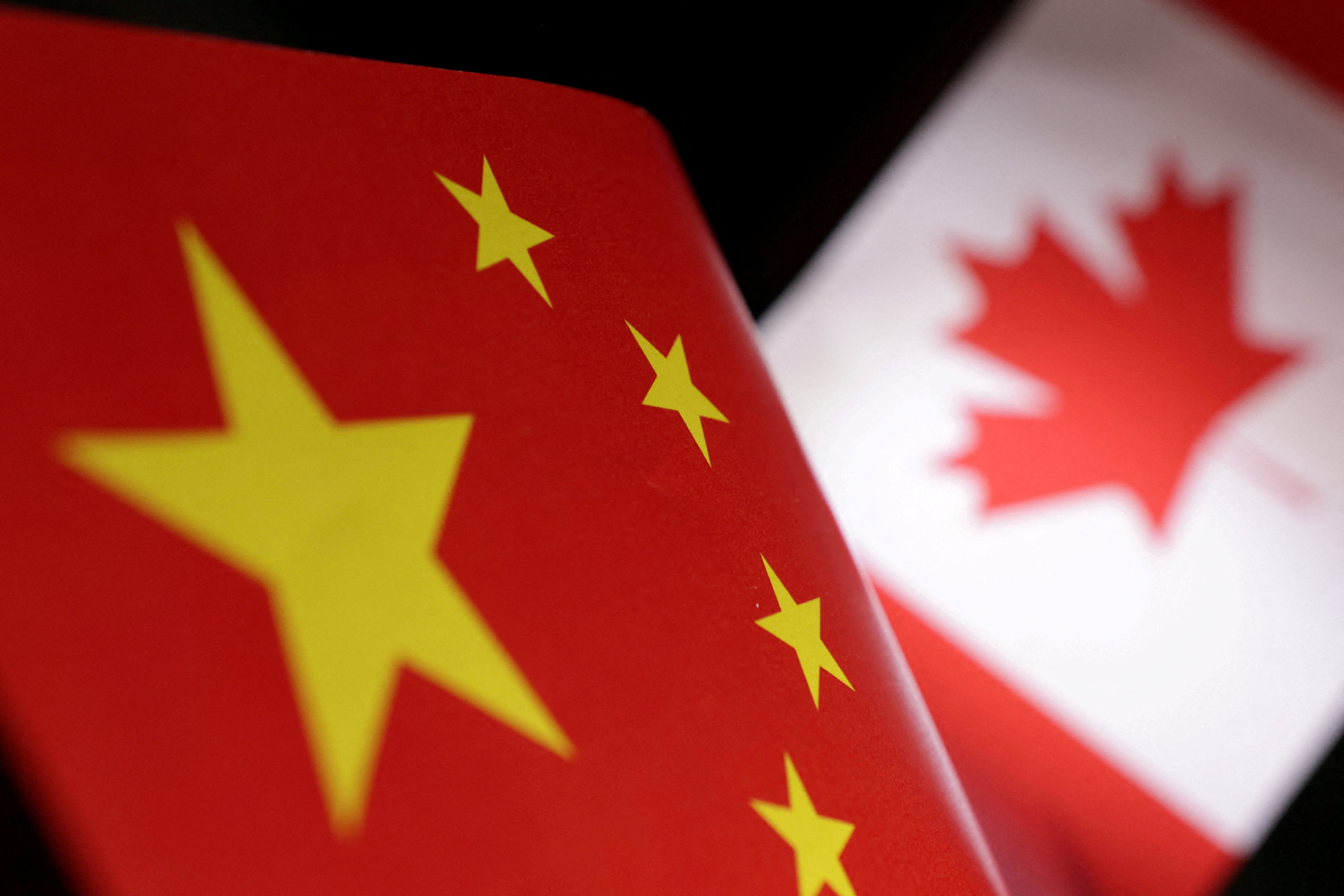 FILE PHOTO: Illustration shows printed Chinese and Canada flags