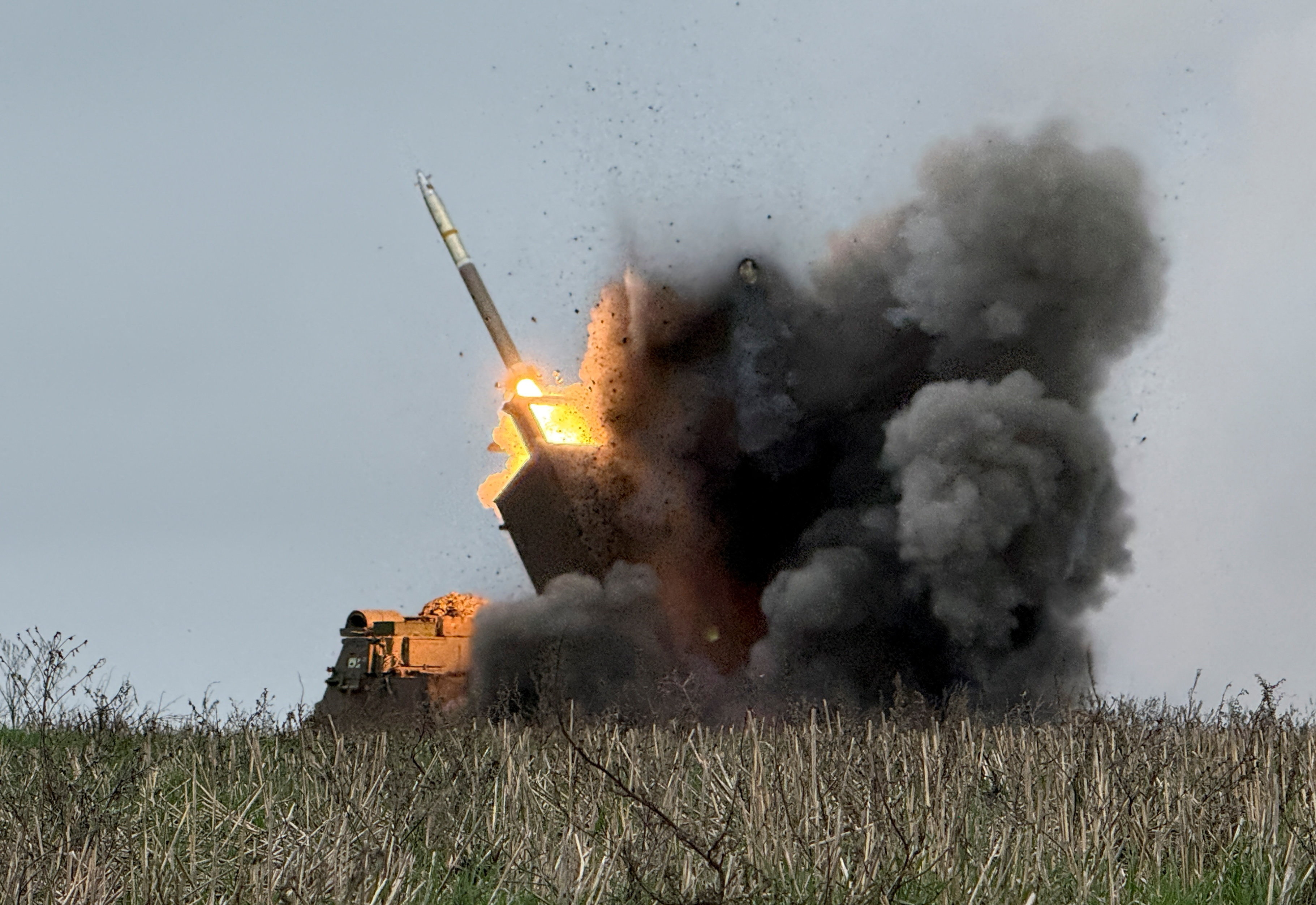 Ukrainian servicemen fire a Multiple Launch Rocket System towards Russian troops near the frontline town of Pokrovsk