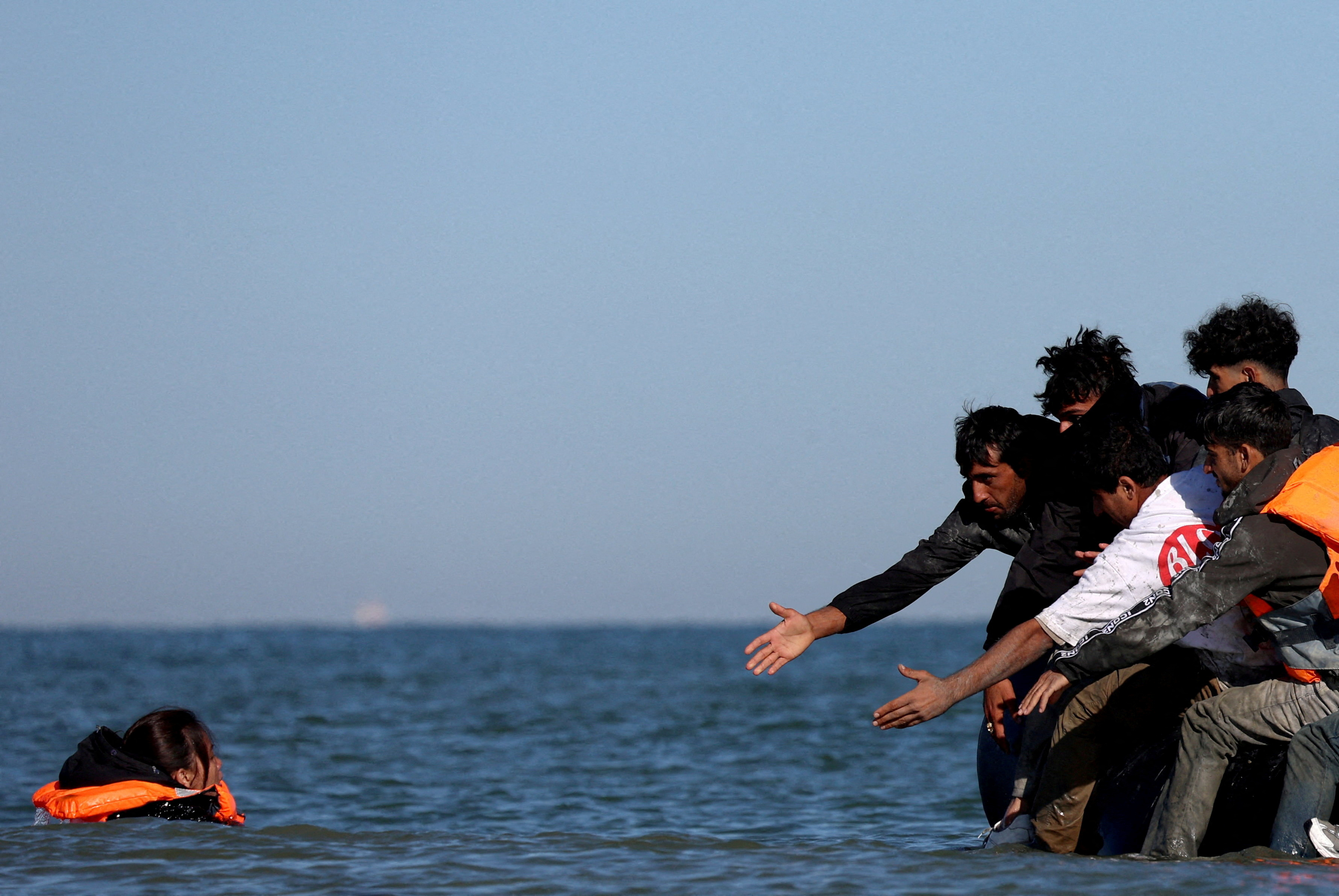 FILE PHOTO: Migrants attempt to cross the English channel from northern France