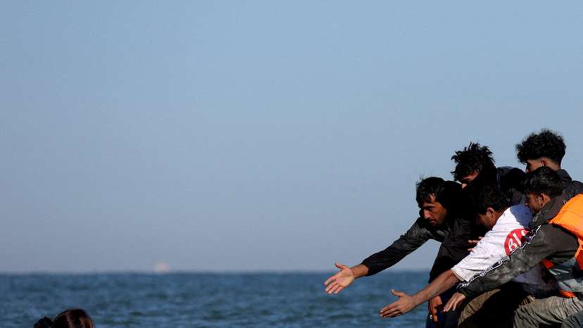 FILE PHOTO: Migrants attempt to cross the English channel from northern France