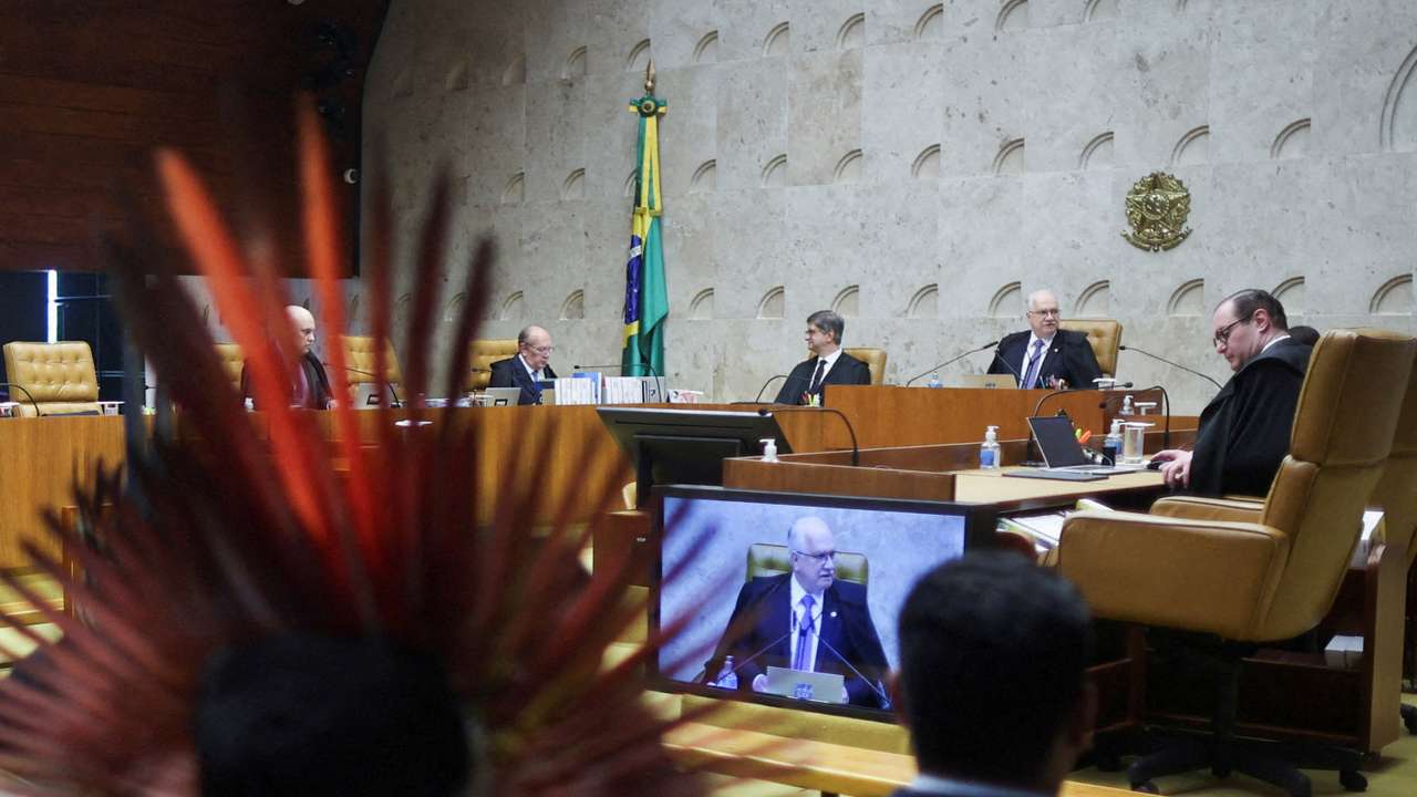 FILE PHOTO: Indigenous people attend a session where judges discuss the so-called legal thesis of "Marco Temporal" (Temporal Milestone) , at the Supreme Court in Brasilia