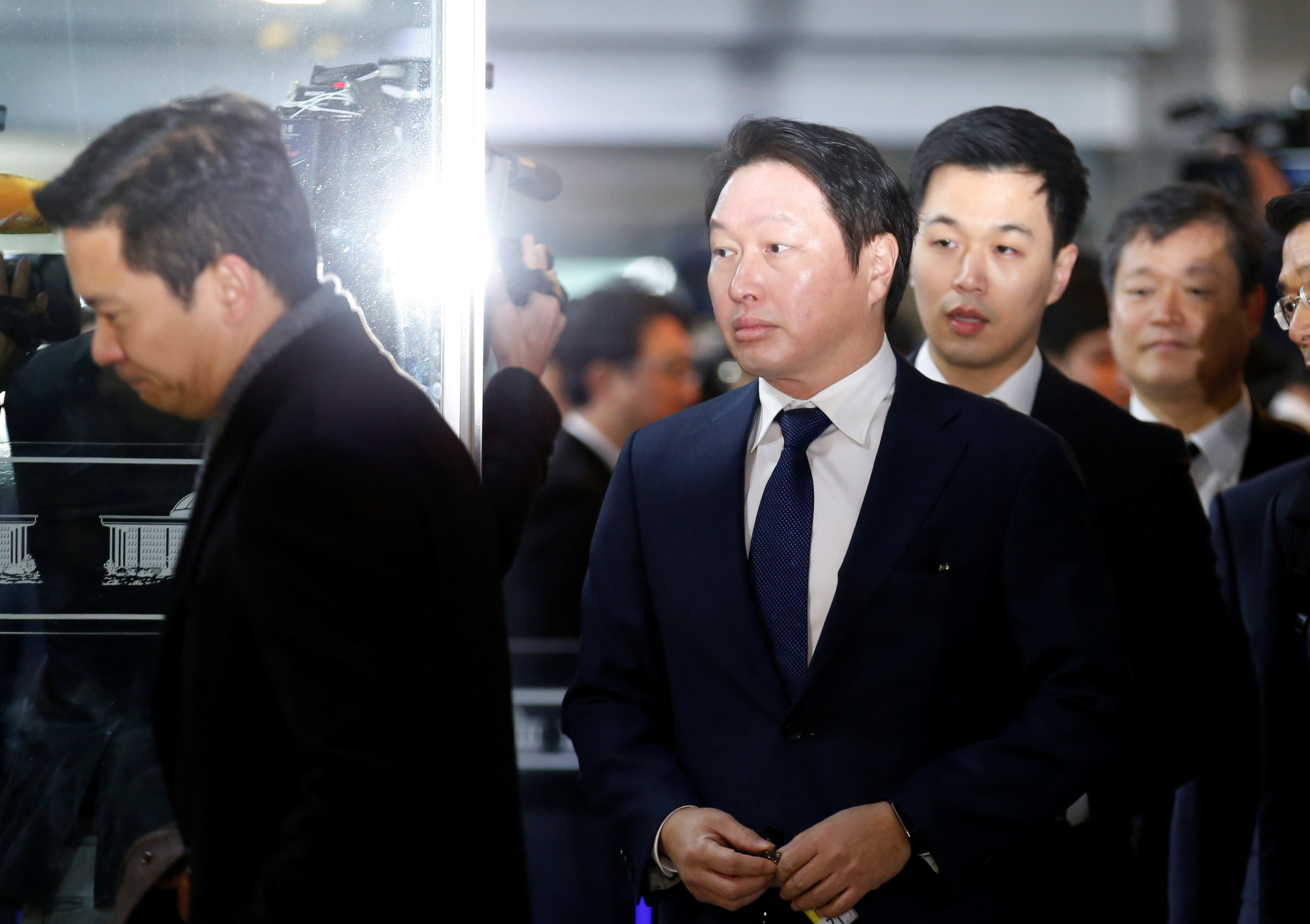 SK Group Chairman Chey Tae-won arrives to attend a hearing at the National Assembly in Seoul
