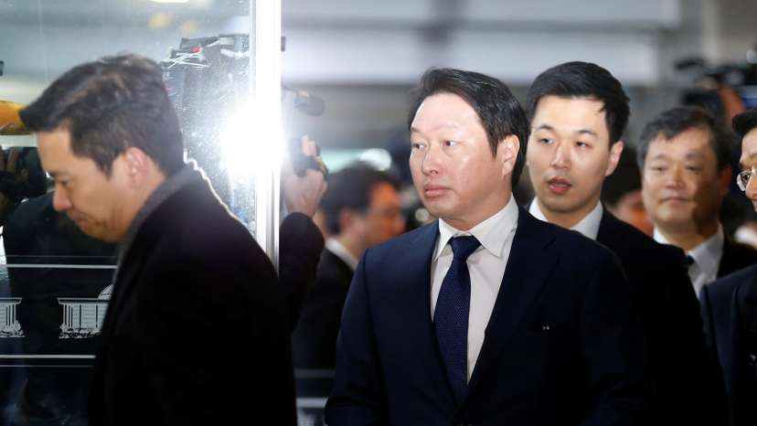 SK Group Chairman Chey Tae-won arrives to attend a hearing at the National Assembly in Seoul