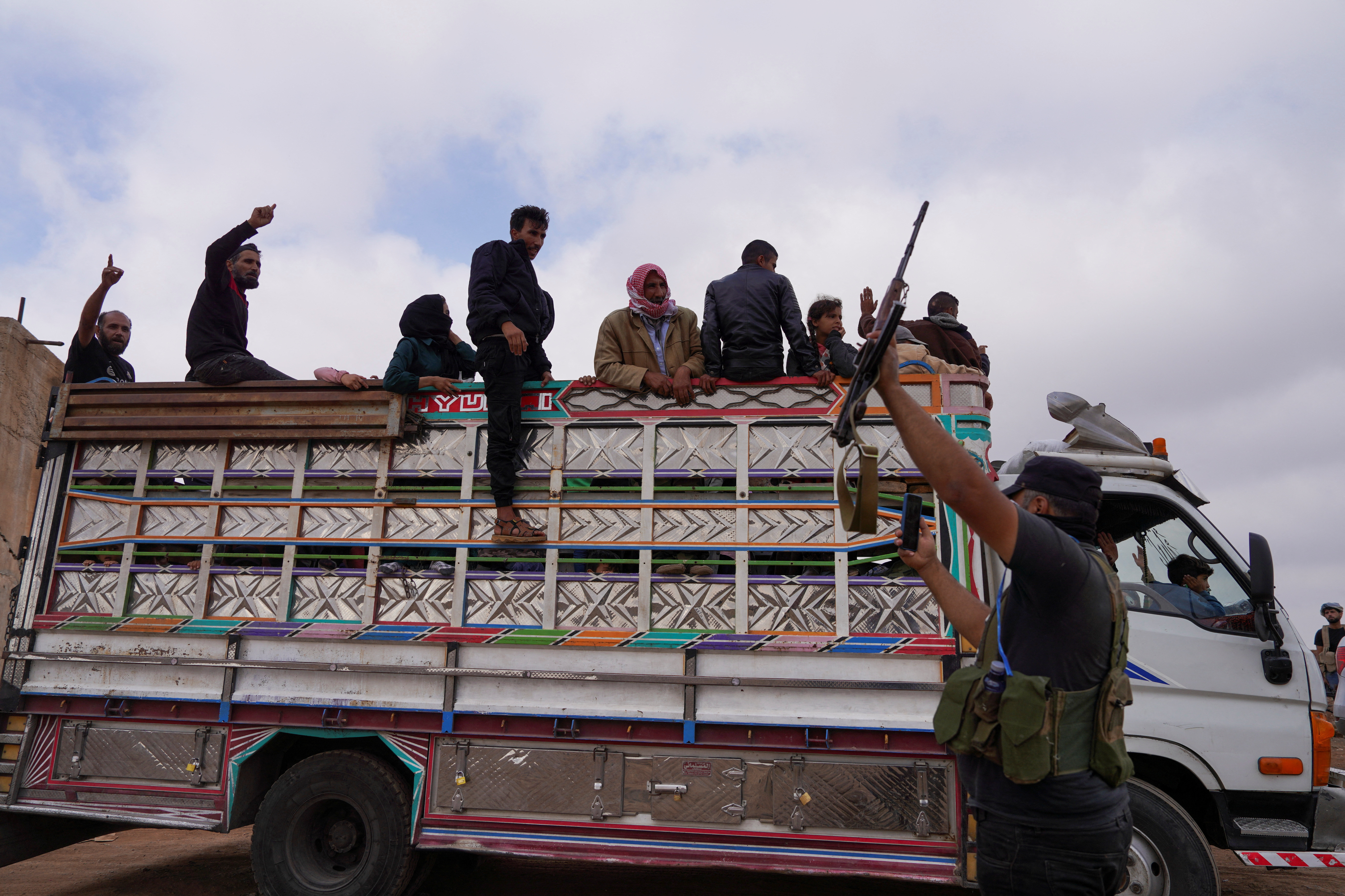 Bedouin families leave the village of Al-Mazraa