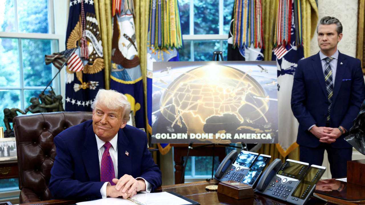 FILE PHOTO: U.S. President Donald Trump and U.S. Defense Secretary Pete Hegseth make an announcement at the White House in Washington