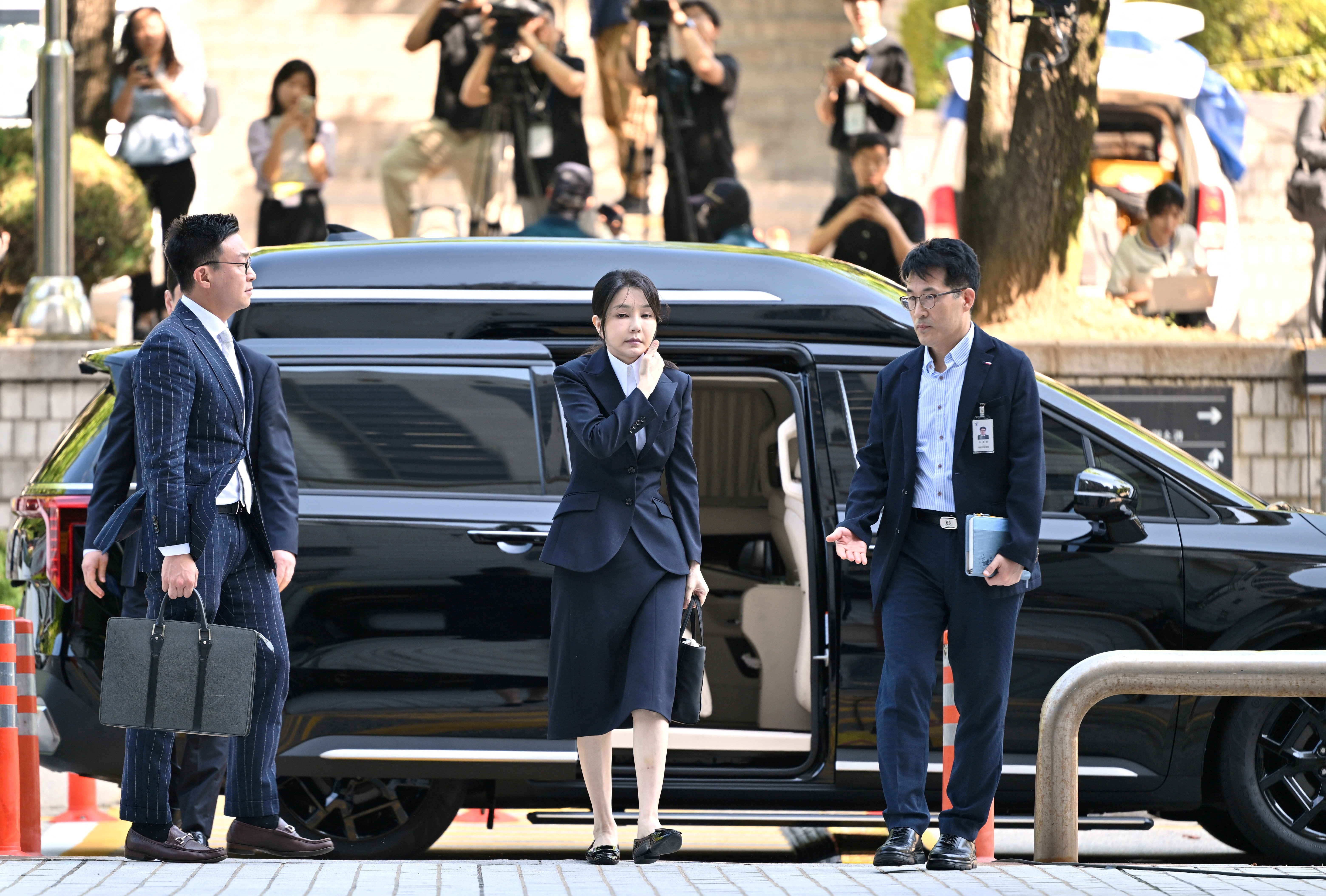 South Korea's former first lady Kim Keon Hee arrives at a court to attend a hearing to review her arrest warrant, in Seoul